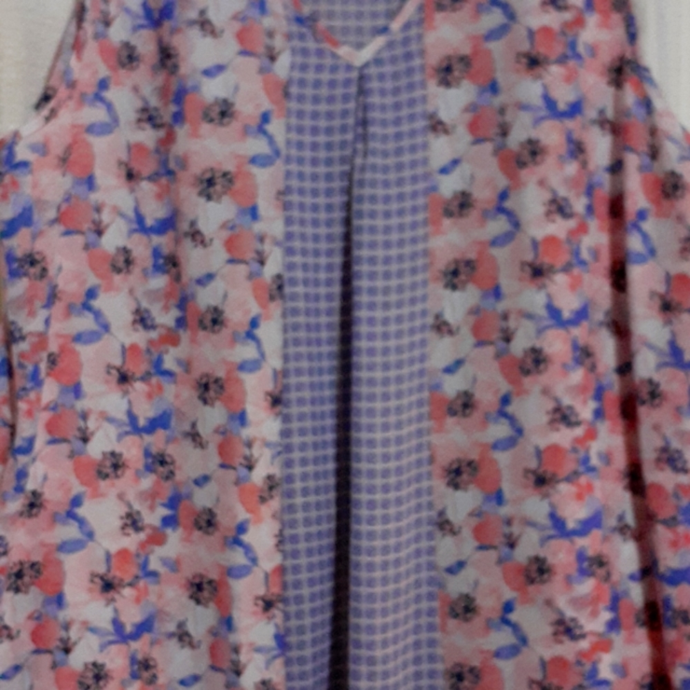 A ladies  shirt thinand lightweight floral print lace on shoulders back hem